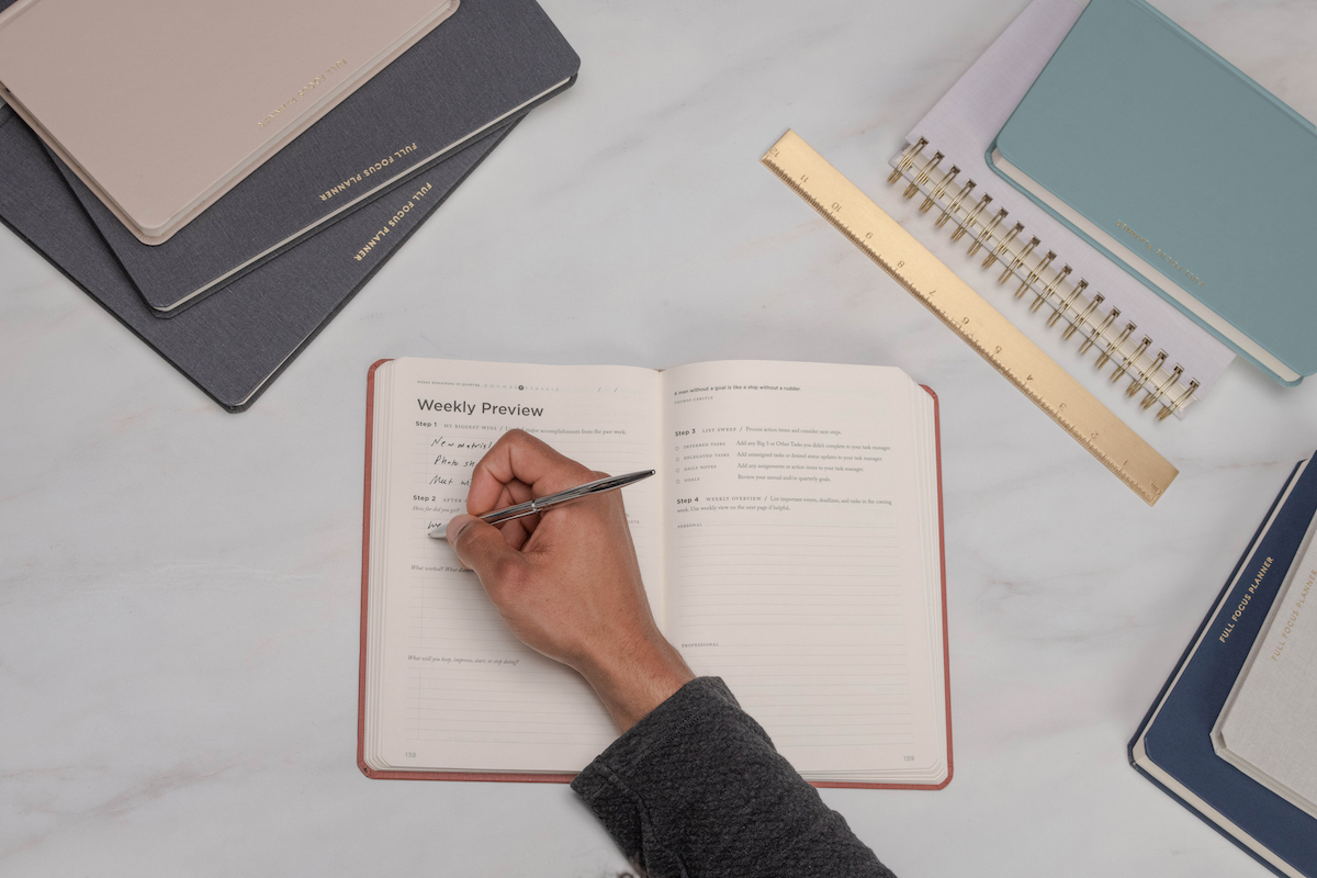 business woman writing in Full Focus planner